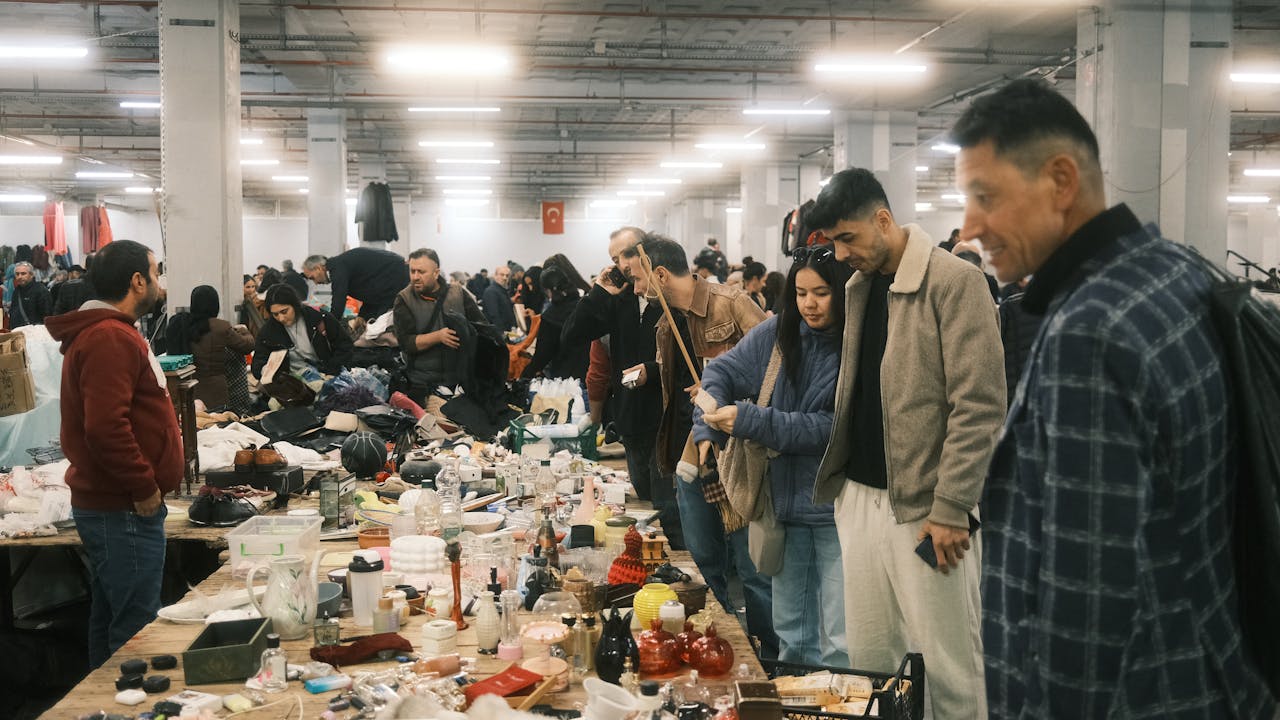 Lively indoor marketplace scene with diverse shoppers in Istanbul, Türkiye.